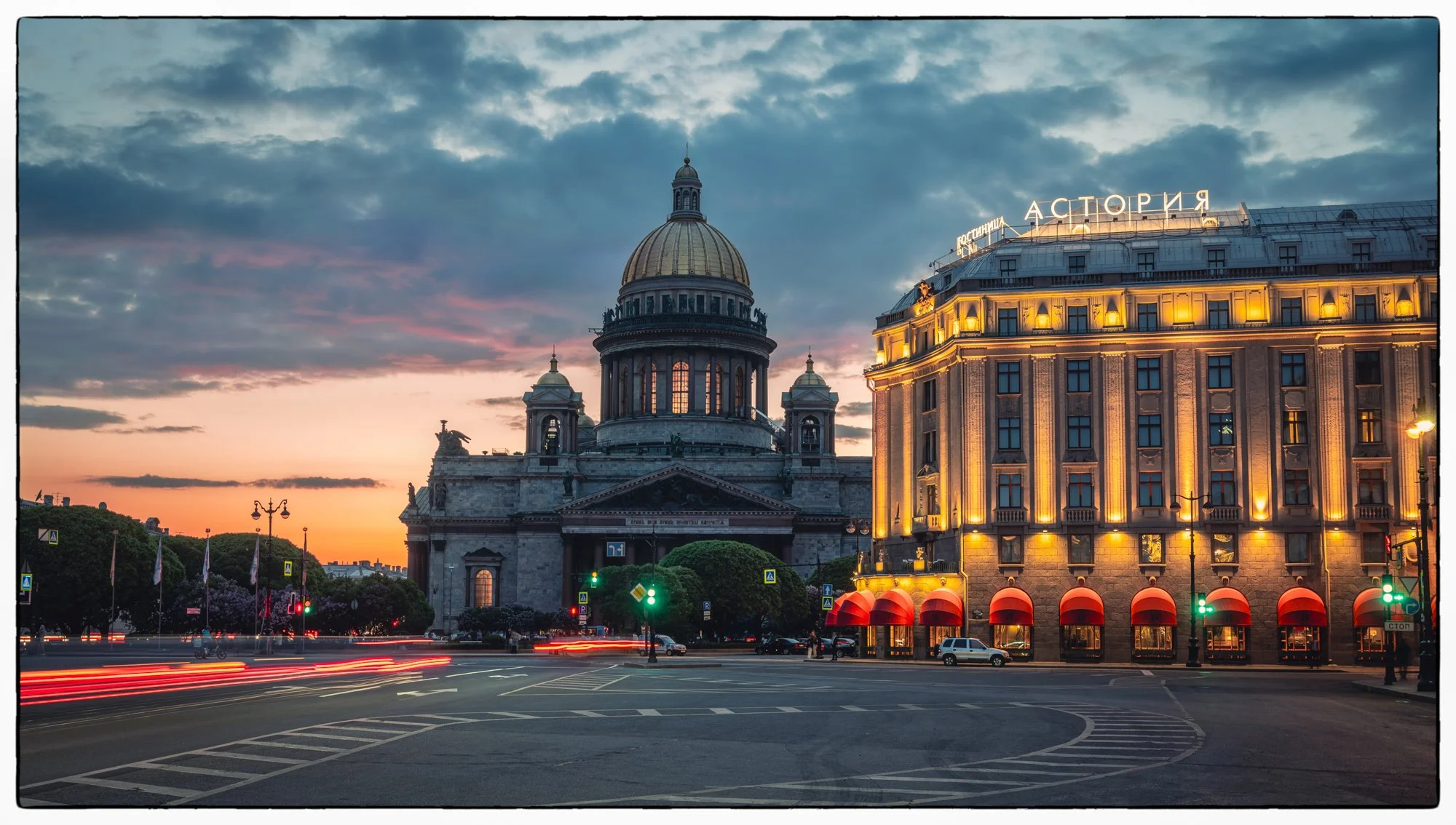 View on the St Isaac Square and cathedral on the back and the famous Astoria hotel on the right just after the sunset 
