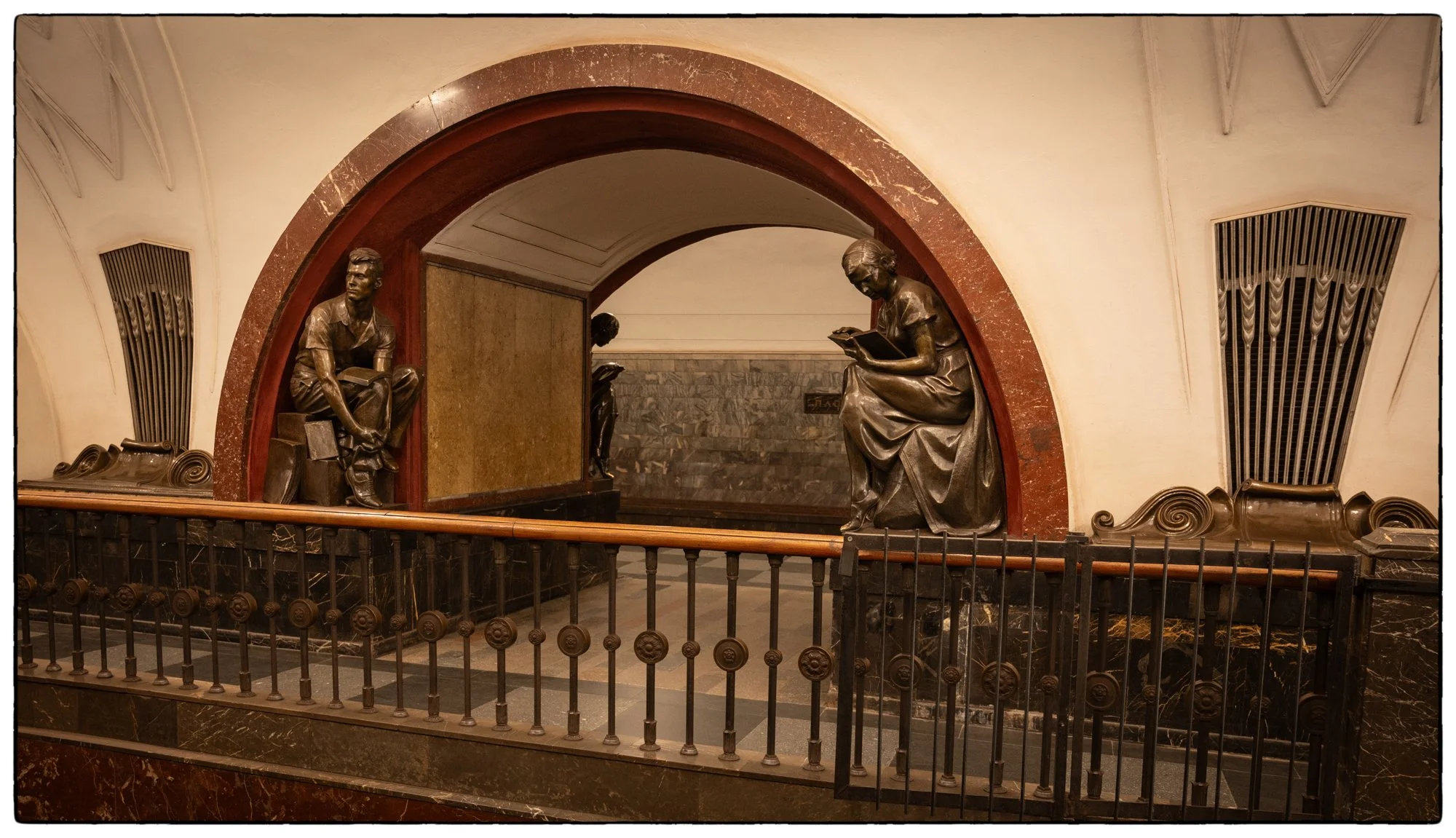 Metro Tour. Revolution Square Station. People rub those bronze sculptures for good luck