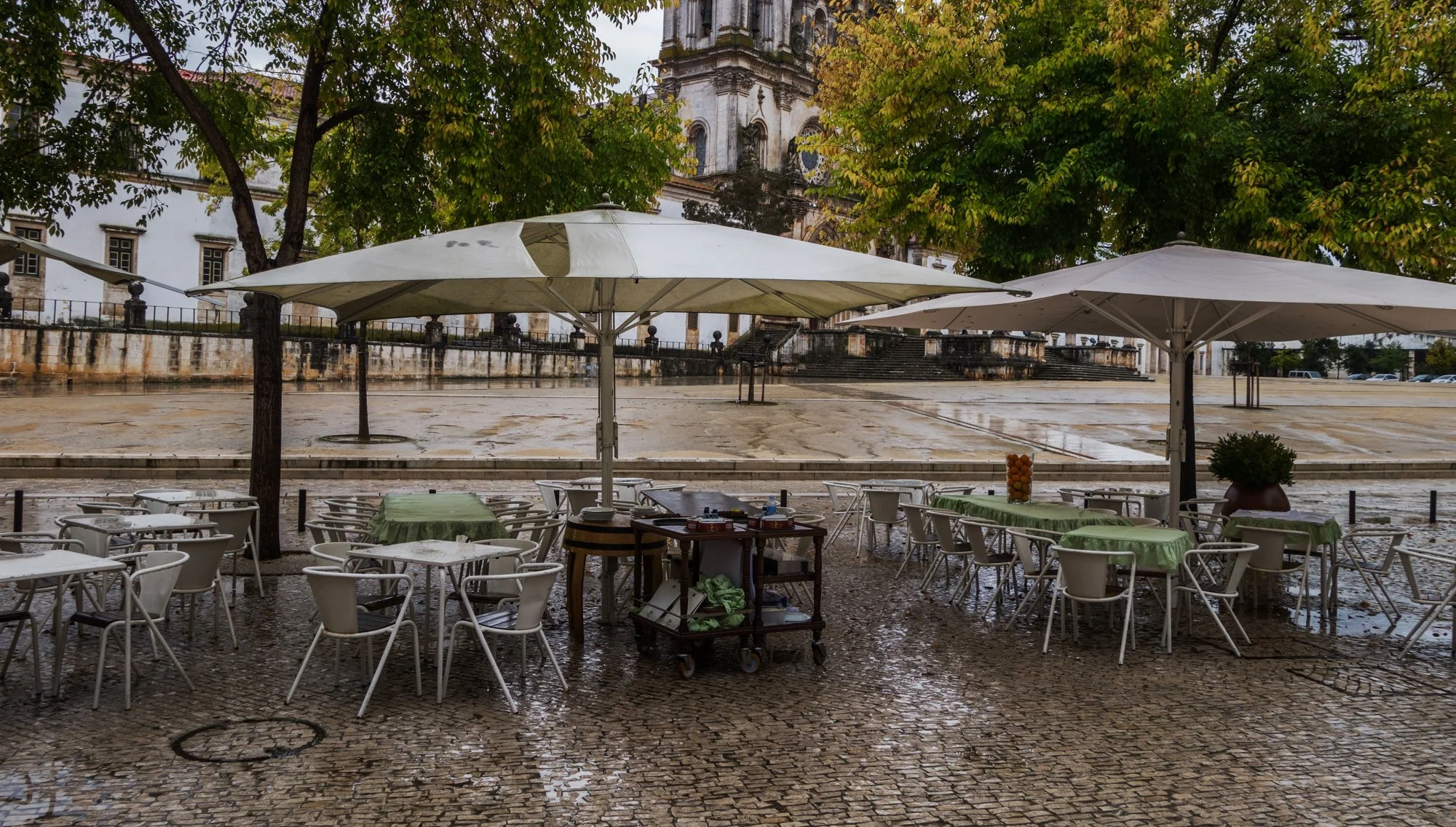 Coffee on the main square, we hide in there from the rain worming ourselves with a glass of fine port. 