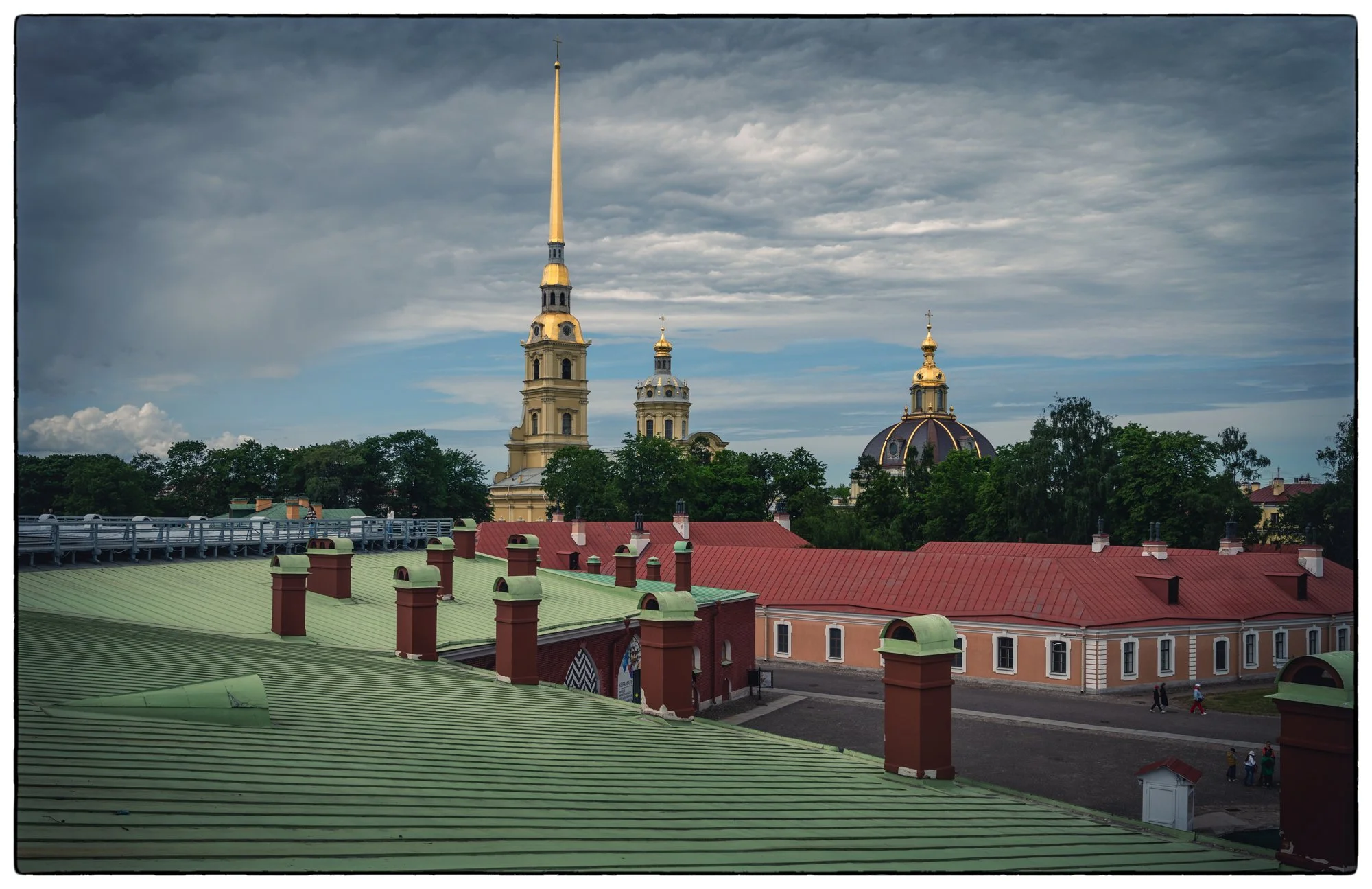 Peter and Paul Fortress, walking on the fortress wall. View on the court yards of the fortress and the Peter and Paul church where the Peter the Great and other tsars are buried