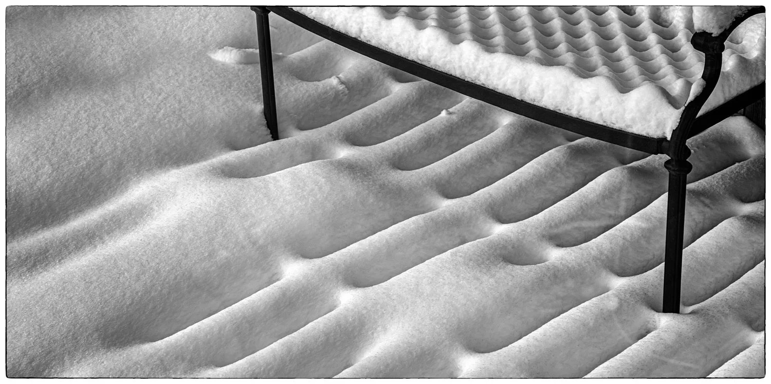 This is a bench on our deck after the snow fall