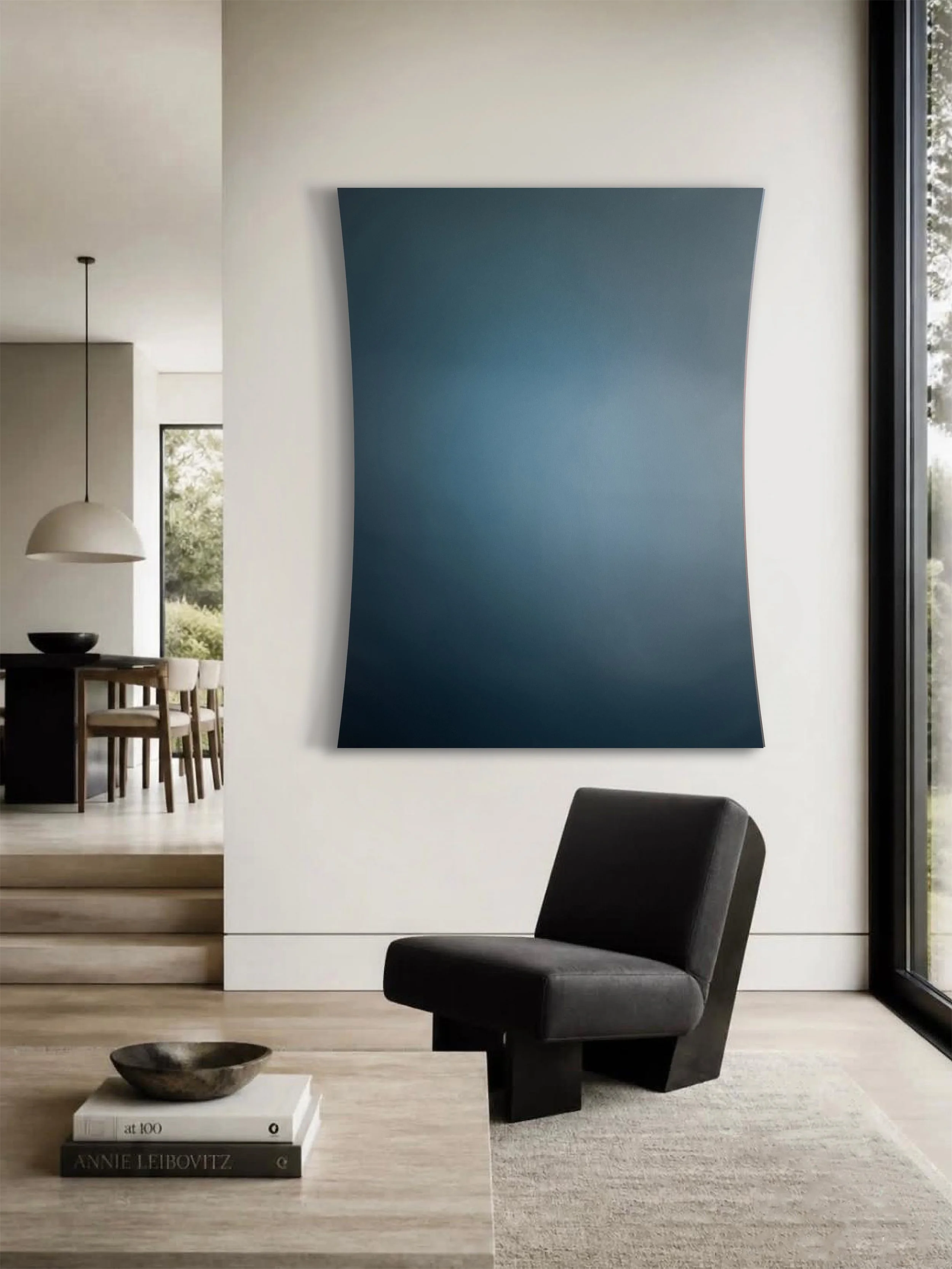 Steely blue color field painting with a lighter, luminous shade towards the center, hanging in a modern light filled living room textile 