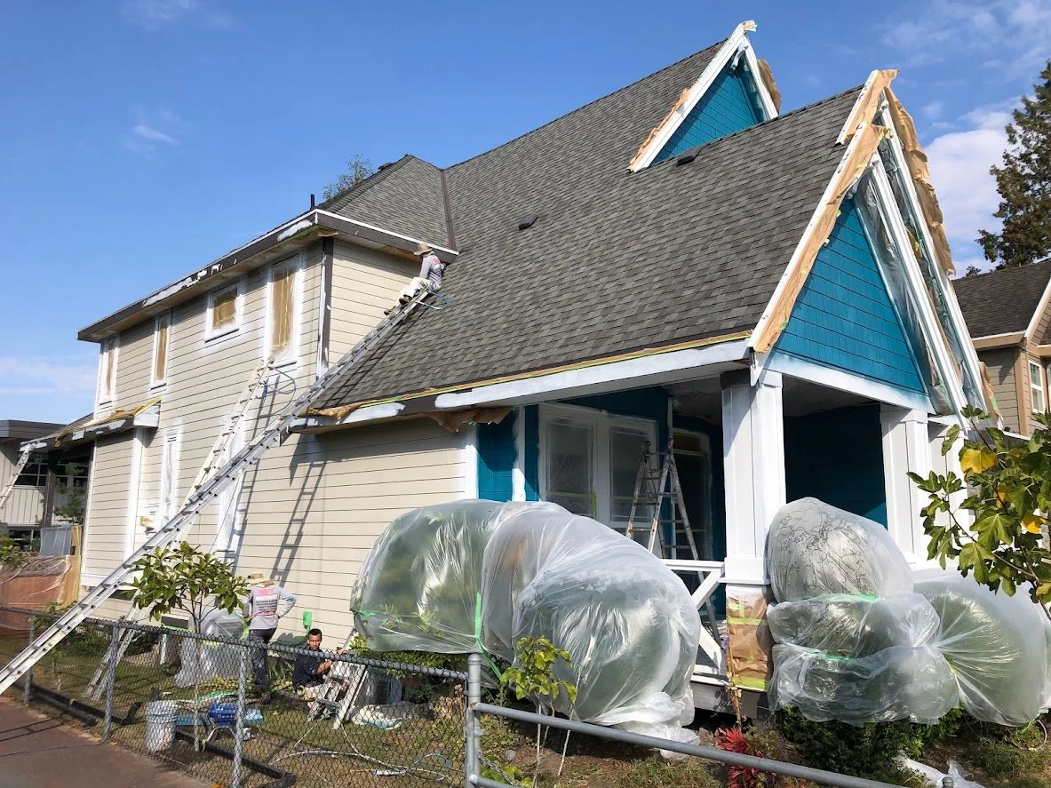 After spraying the trim, we are spraying the siding blue!