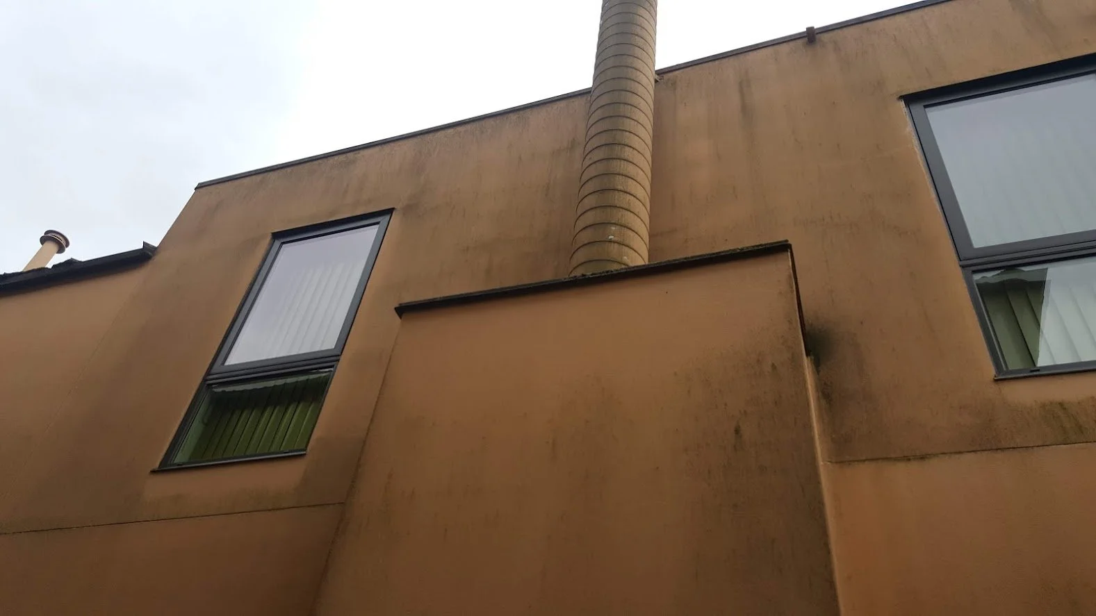 Before ... you can see how dirty, faded and old the stucco looks before we pressure washed it and then painted it!