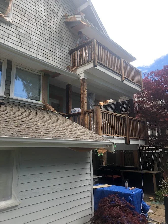 After spraying the siding / shingles, before spraying the railings / spindles!