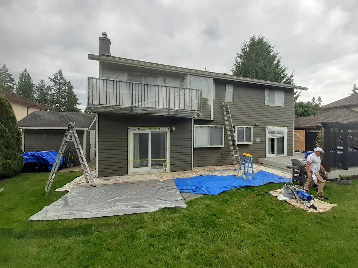After prep, masking before spraying the siding!