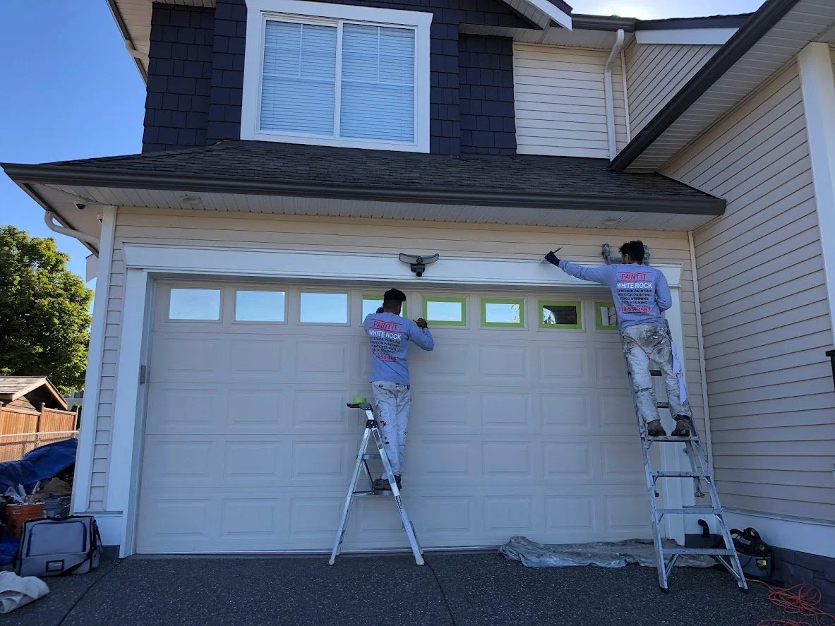 Top finished, taping off the window panes on the garage door before we paint it a fresh white!