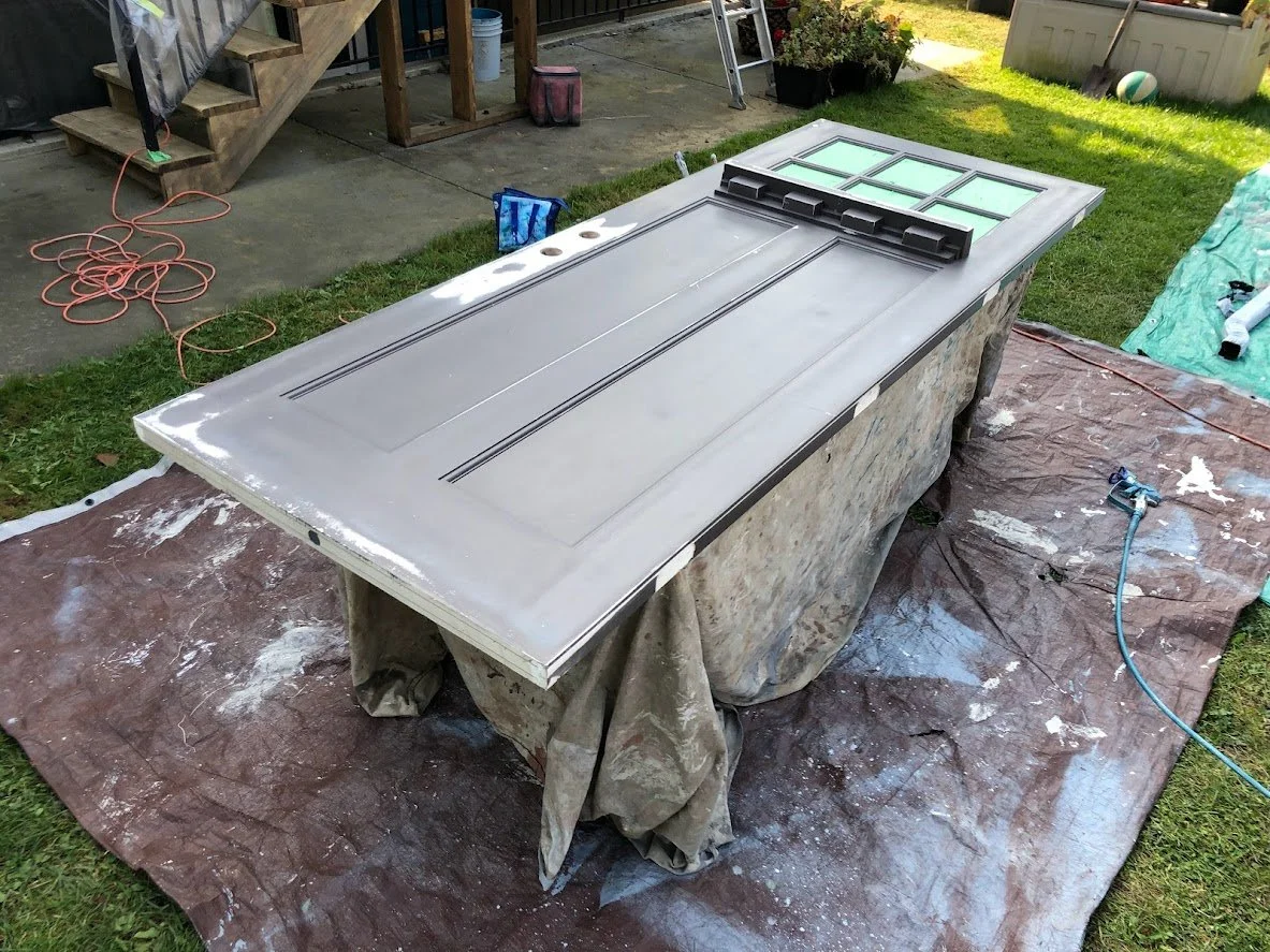 Removed the hardware fixtures, and sanded the surfaces to smooth out the uneven spots. Next up: priming