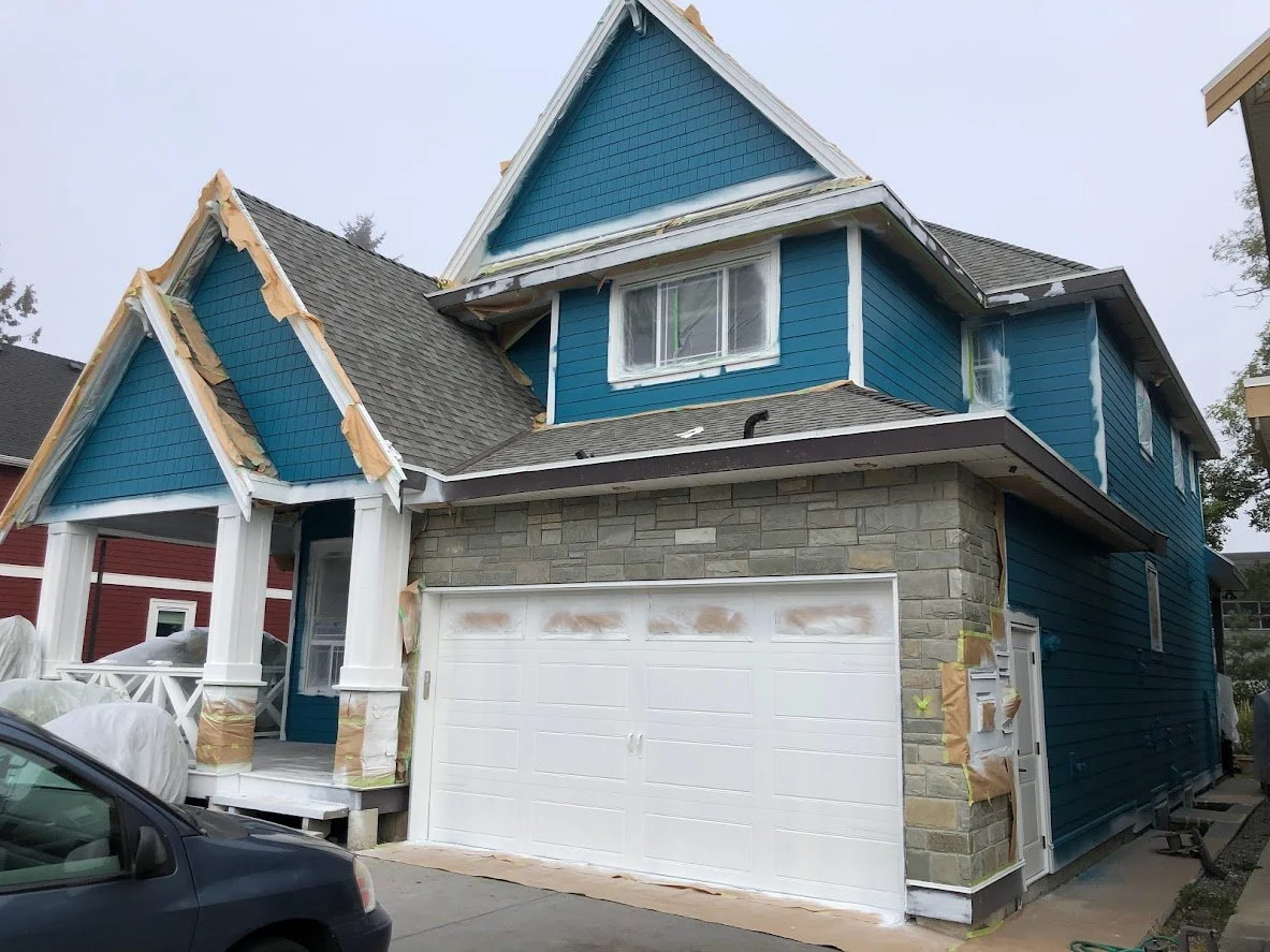 After prep, after spraying, before we take off the masking and paint the trim & fascia boards!