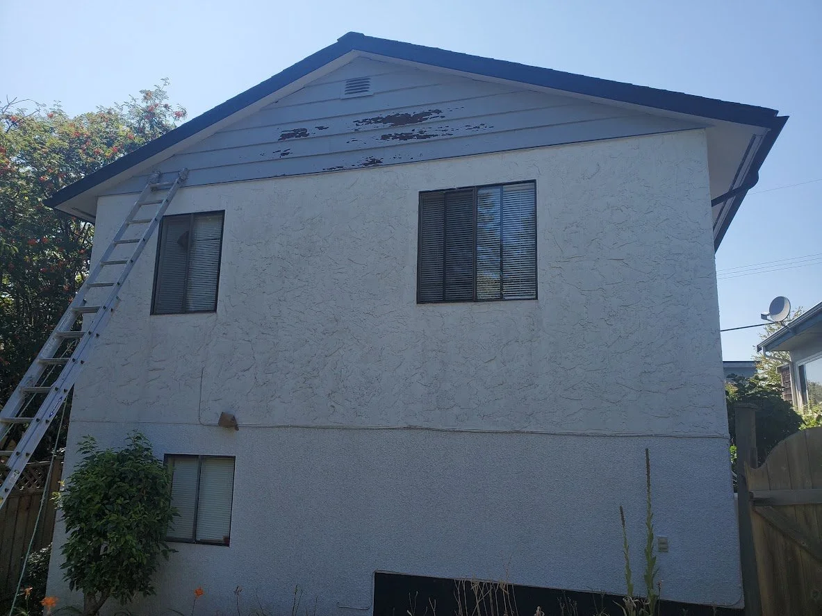 Before (notice the chipping & peeling paint on the siding near the peak)