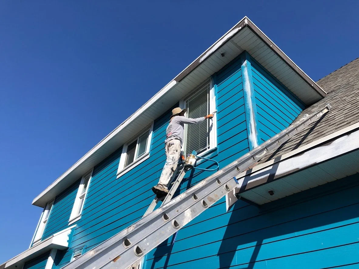 After prep, after spraying the siding, painting the trim and fascia boards!