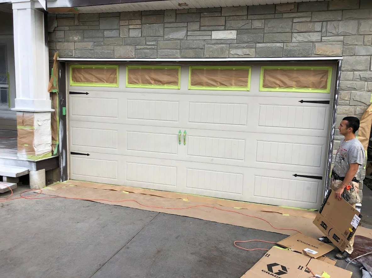 Before ... we've masked off the garage door before we spray it