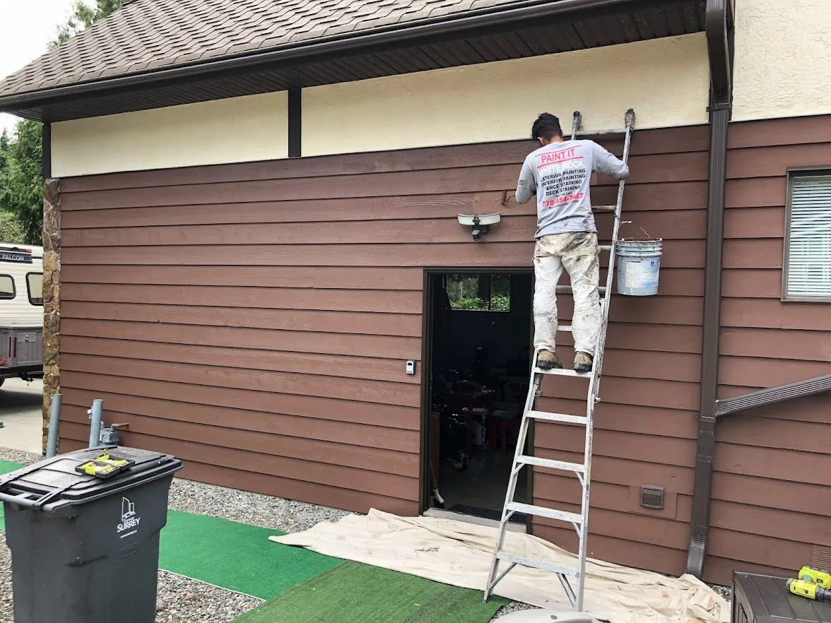 We're freshening up this siding by applying a new coat of brown!