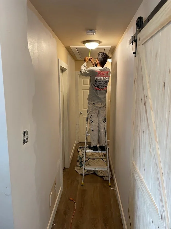 Masking off and covering everything before spraying!
