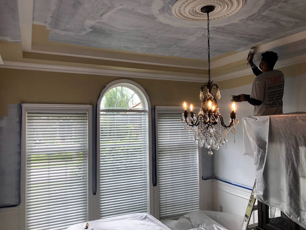We had painted the crown molding and are cutting in the ceiling and walls here!