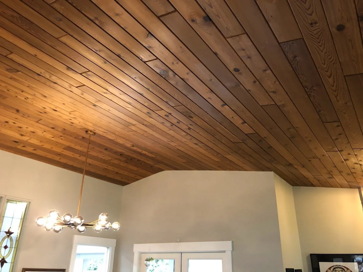 Before ... this beautiful wood ceiling had several stain marks, and it was too dark for the client, so we sprayed it a fresh, bright white!
