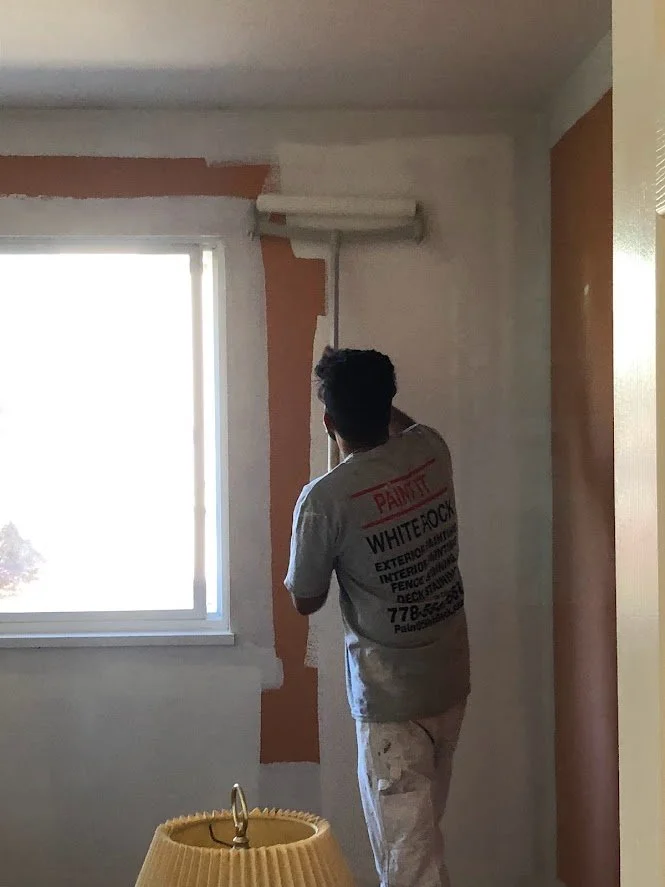 This client was prepping their house to sell it, so they were painting over all of these bold colours to give the house a more neutral colour. 