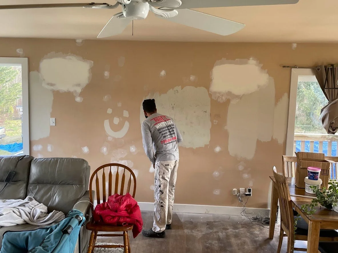 Before .... notice all of the wall patches and touch ups. We are pole sanding the walls before we mask off everything before spraying the ceiling & trim!