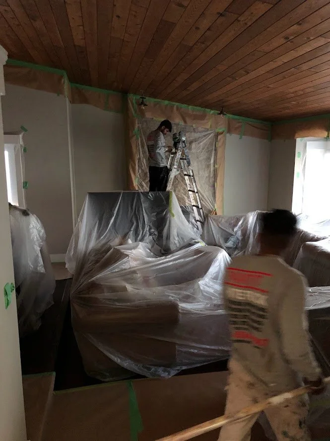 Before ... we are masking off the walls and covering everything before we spray the primer!