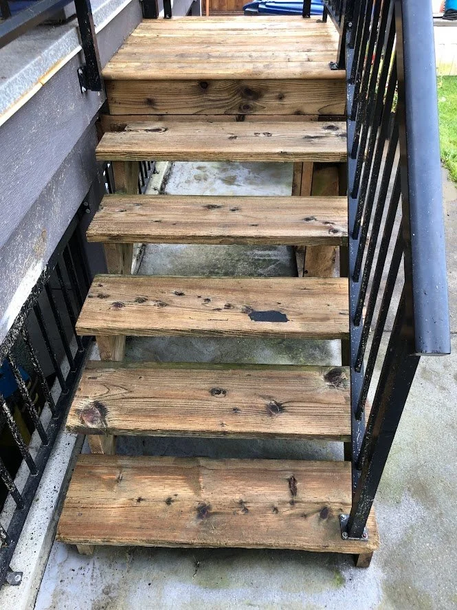After pressure washing, before sanding