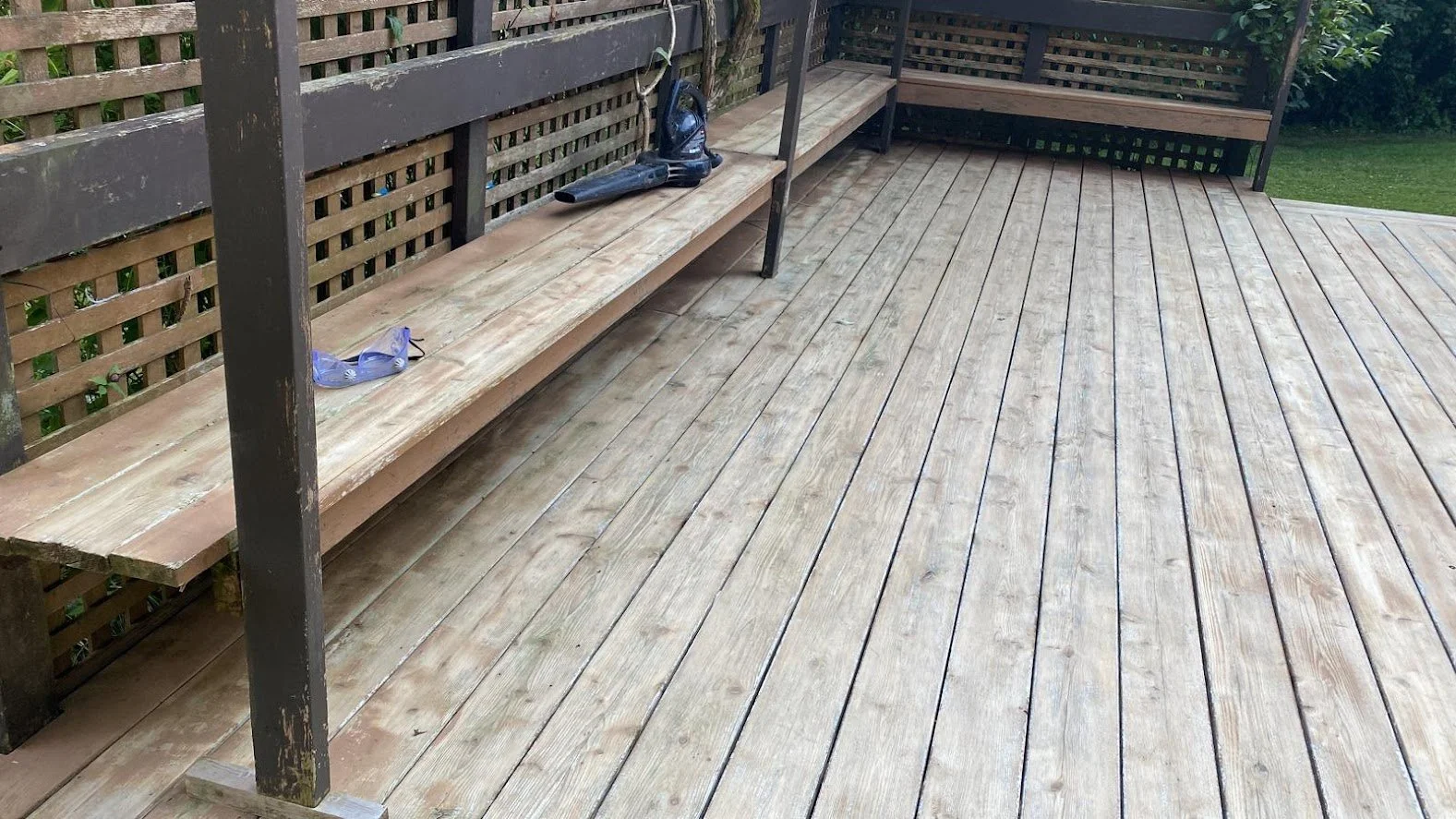 After pressure washing, before sanding
