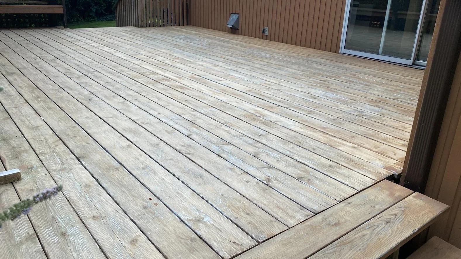 After pressure washing, after sanding, before staining