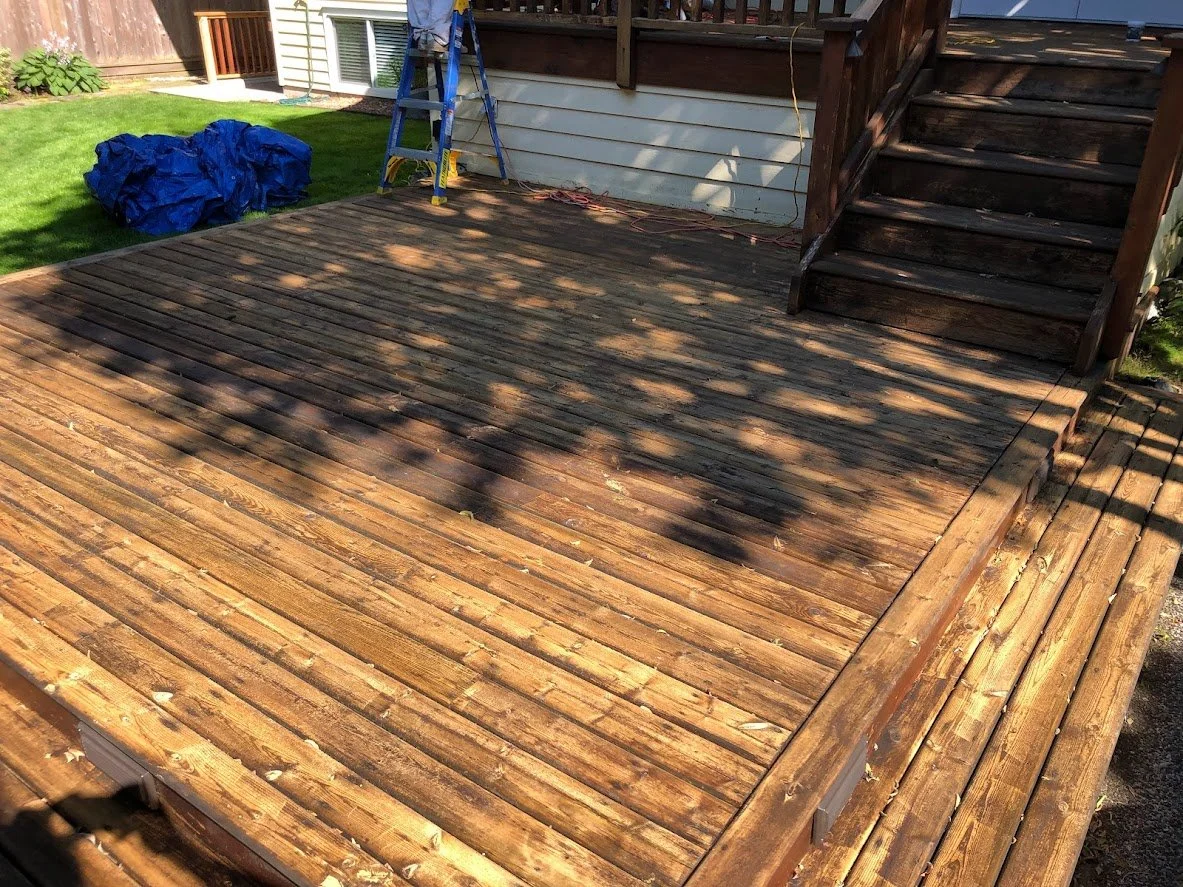 After pressure washing, before sanding