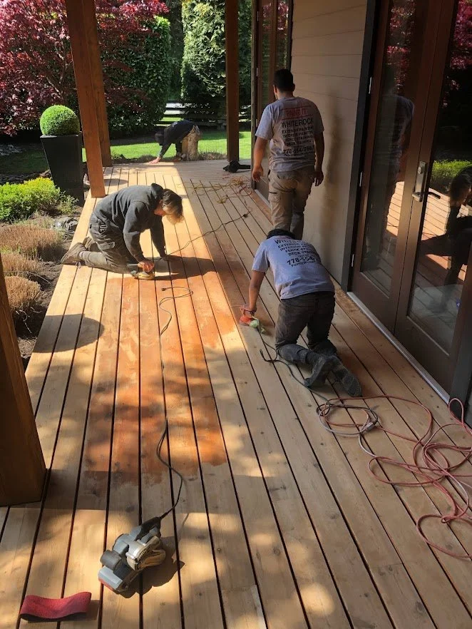 After pressure washing, sanding the deck before staining!