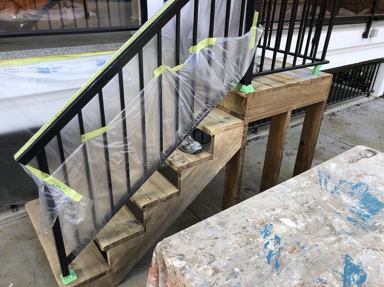After pressure washing, before staining