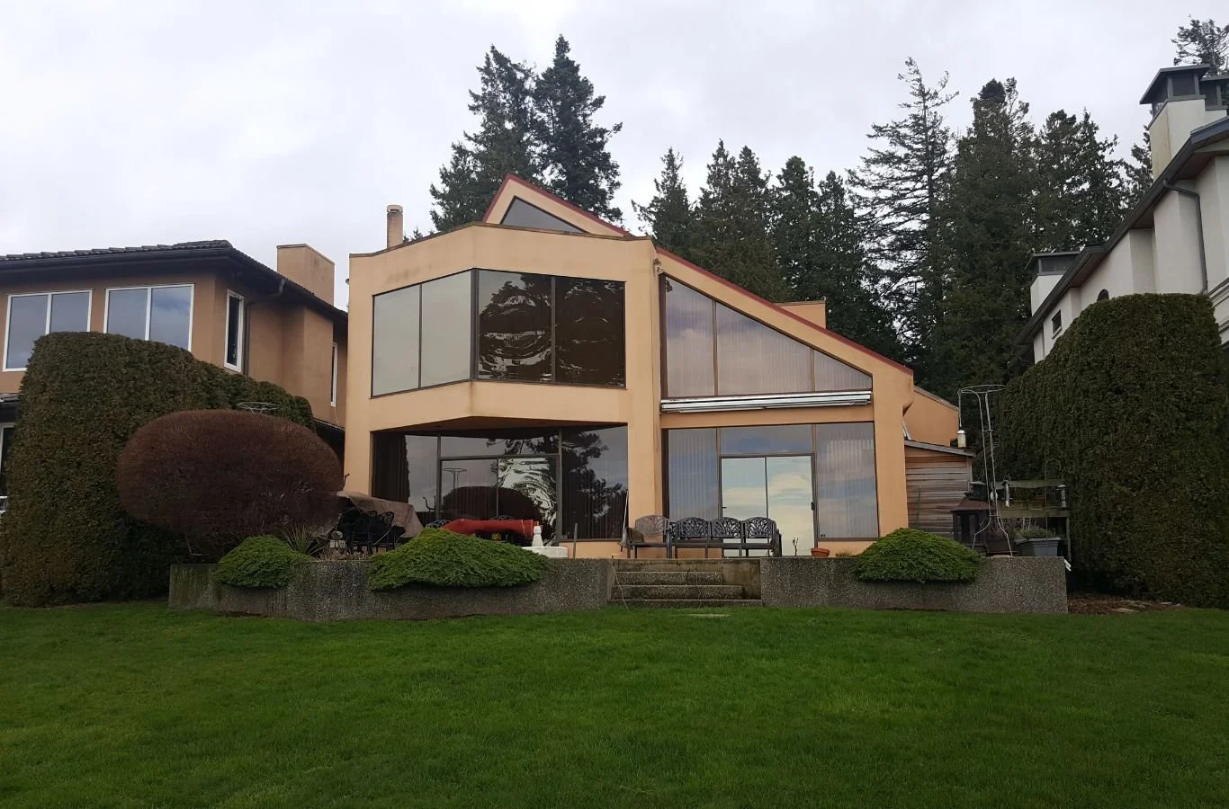 A skilled painter from Paint It White Rock applying a fresh coat of paint in Langley, BC, demonstrating expert craftsmanship.