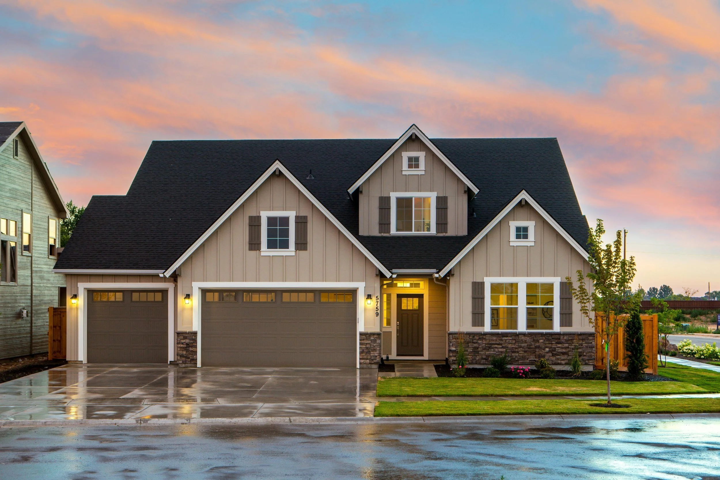 Professional painters using high-quality materials for exterior house painting, ensuring a durable and flawless finish.