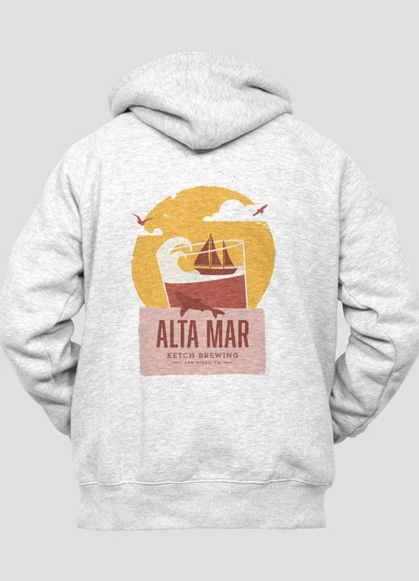 Back of a light gray hoodie featuring an illustration of a sailboat on the water, with a yellow sun, white clouds, and birds, and the text "ALTA MAR KEETCH BREWING SAN DIEGO, CA" in pink.