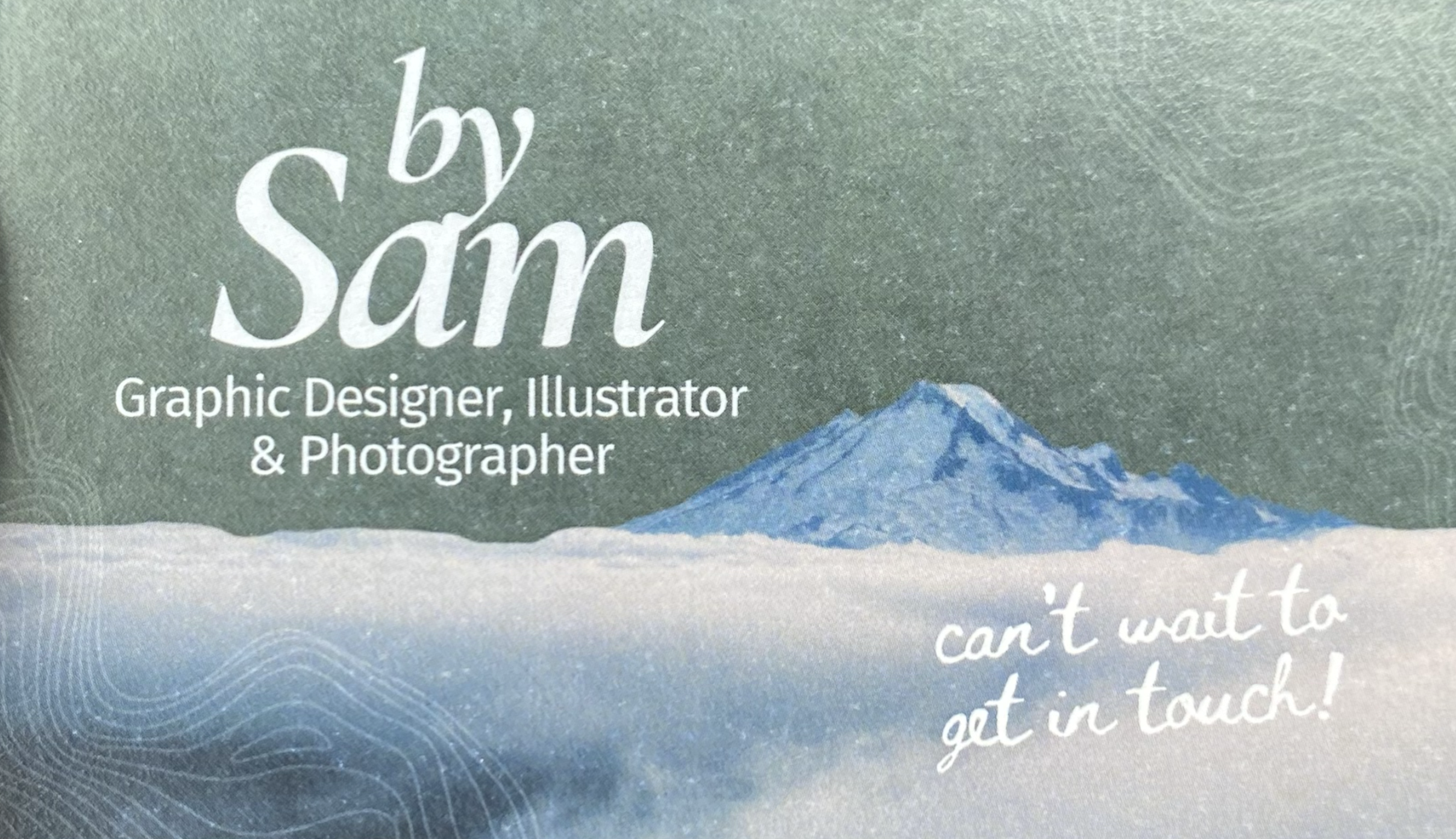 Book cover with an illustration of a mountain and text indicating the author is a graphic designer, illustrator, and photographer.