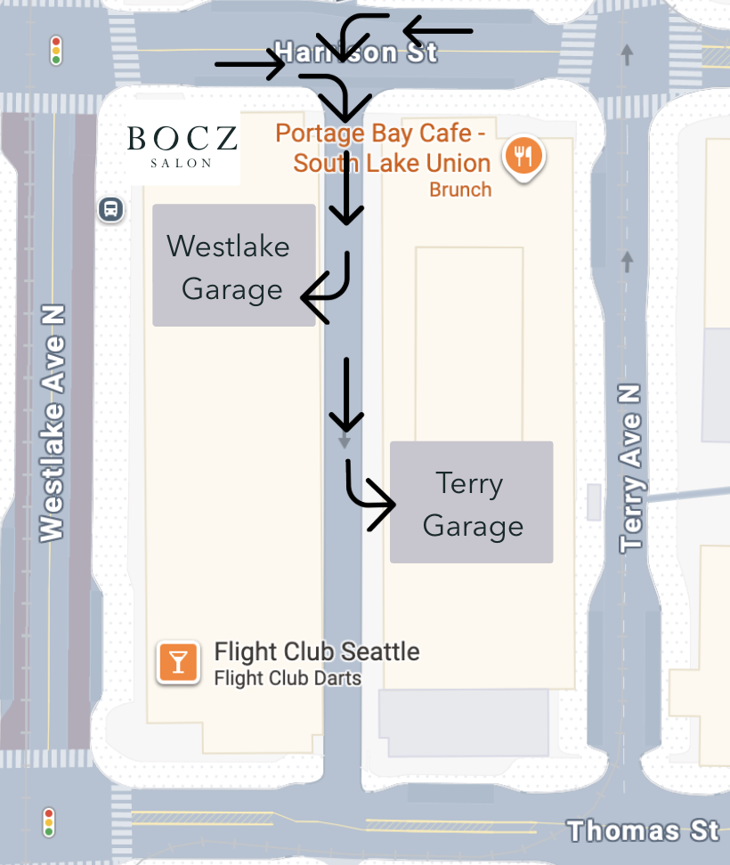 Map showing the location of Portage Bay Cafe - South Lake Union, Westlake Garage, Terry Garage, and Flight Club Seattle on streets including Harison Street, Westlake Avenue North, and Terry Avenue North; arrows indicate a route from Harrison Street south along Westlake Avenue N to Thomas Street.