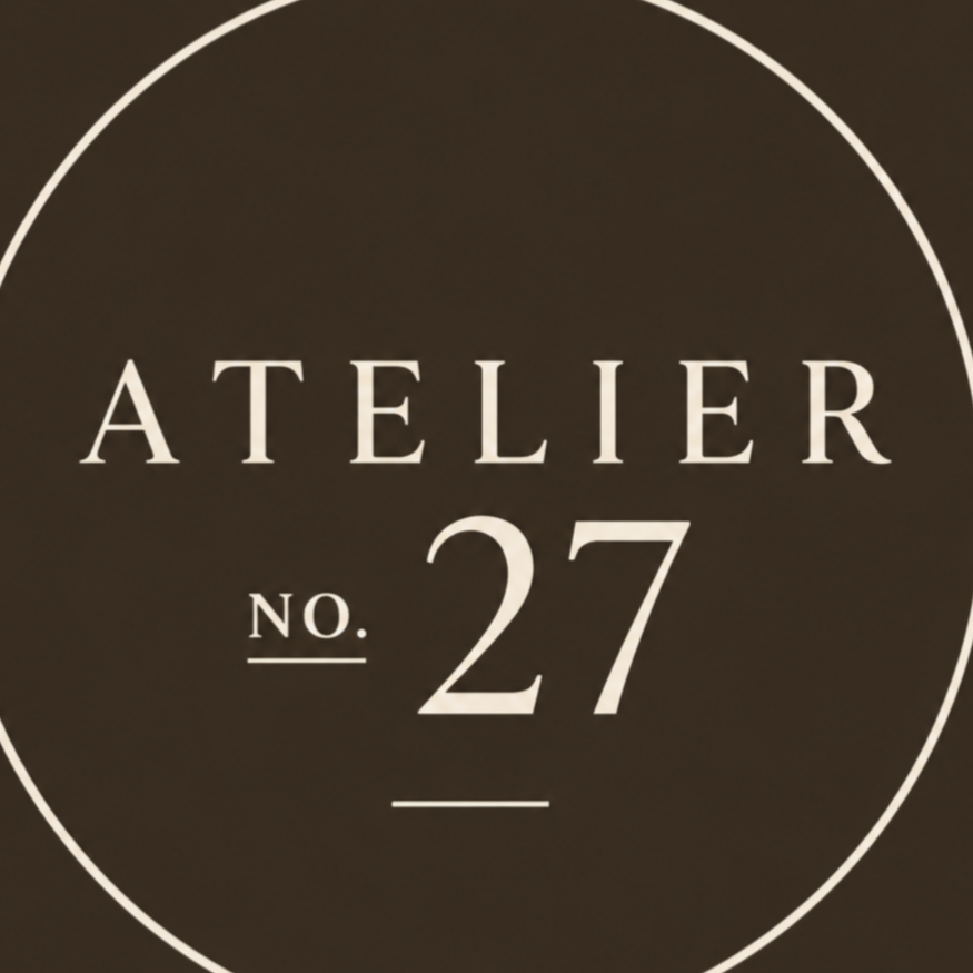 A black background with white text that reads "Atelier No. 27" inside a thin white circle.
