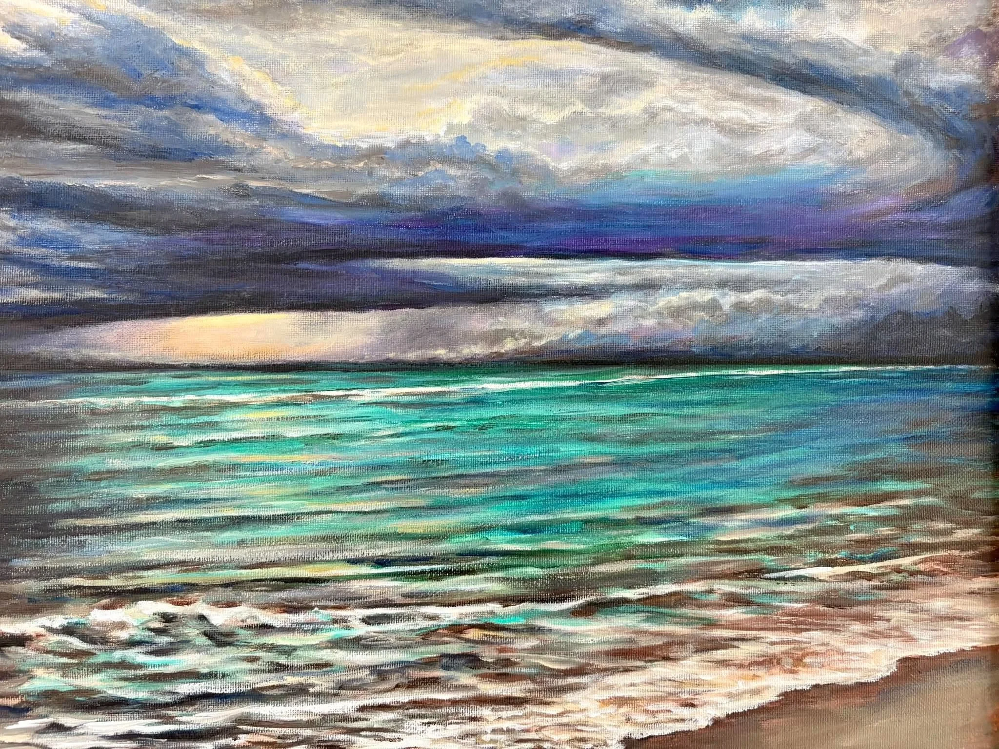 A painting of a cloudy sky over a body of water with waves, using shades of blue, gray, and hints of yellow.