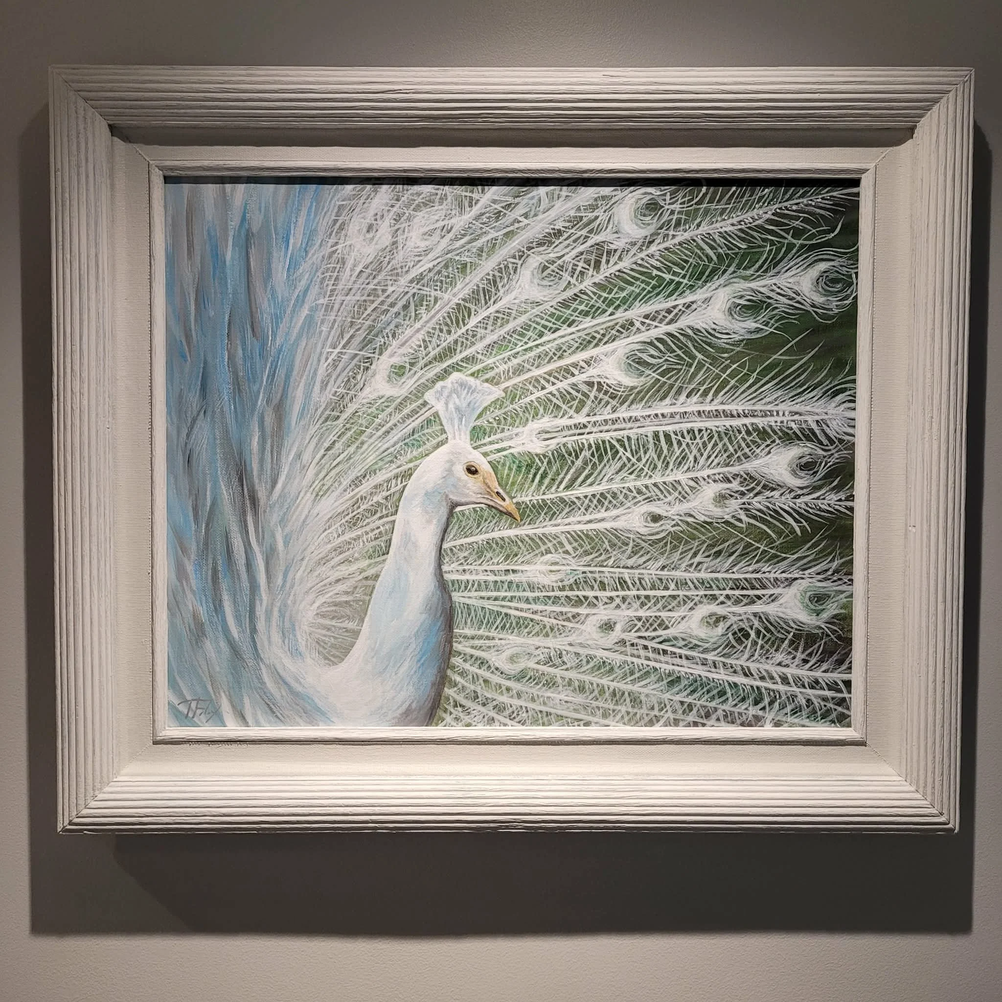 Painting of a white bird, possibly a snowy egret, with detailed feathers on a green and blue background, framed in a white wooden frame.