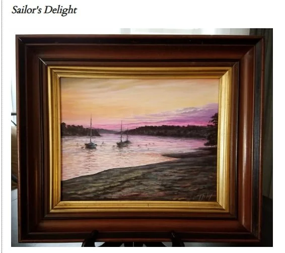 A framed painting titled 'Sailor's Delight' depicting sailboats on a river at sunset with pink and purple sky.