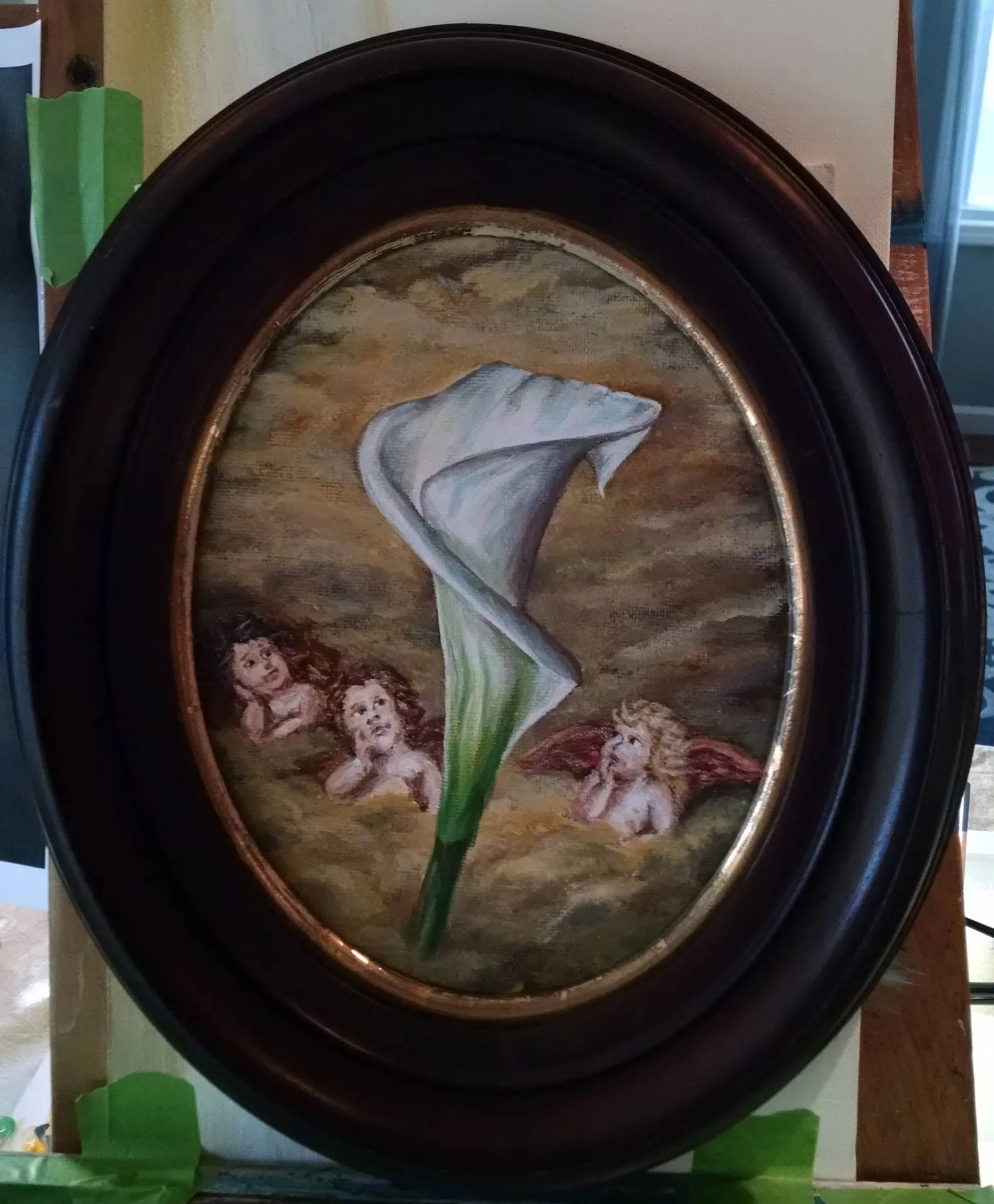 A framed painting of a flower with three childlike cherubs at the bottom, set against a cloudy sky background.