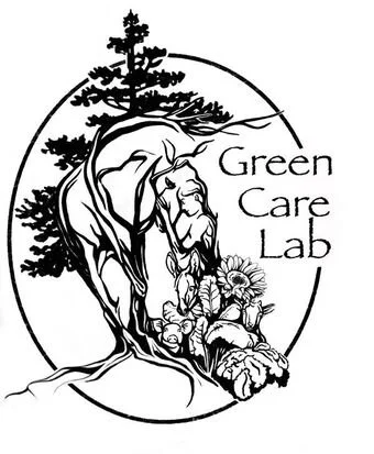 Logo featuring a stylized tree, a lion, and flowers with the text 'Green Care Lab'.