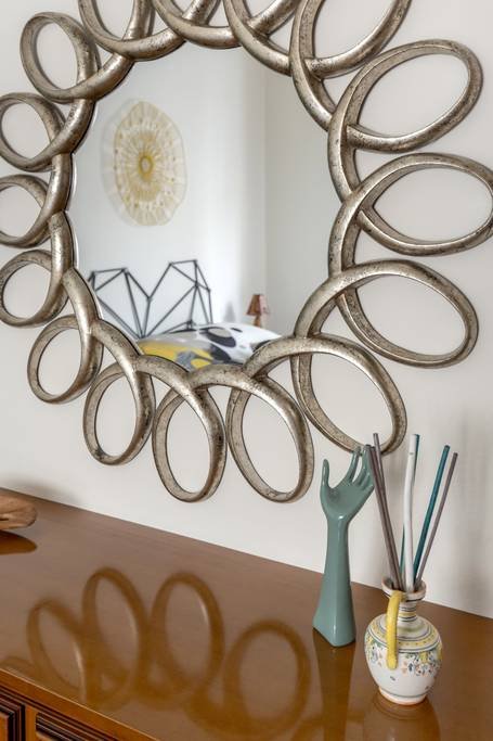 Bedroom mirror and decor detail at Casa Luce Tuscany, a welcoming apartment in Poggibonsi, Tuscany.