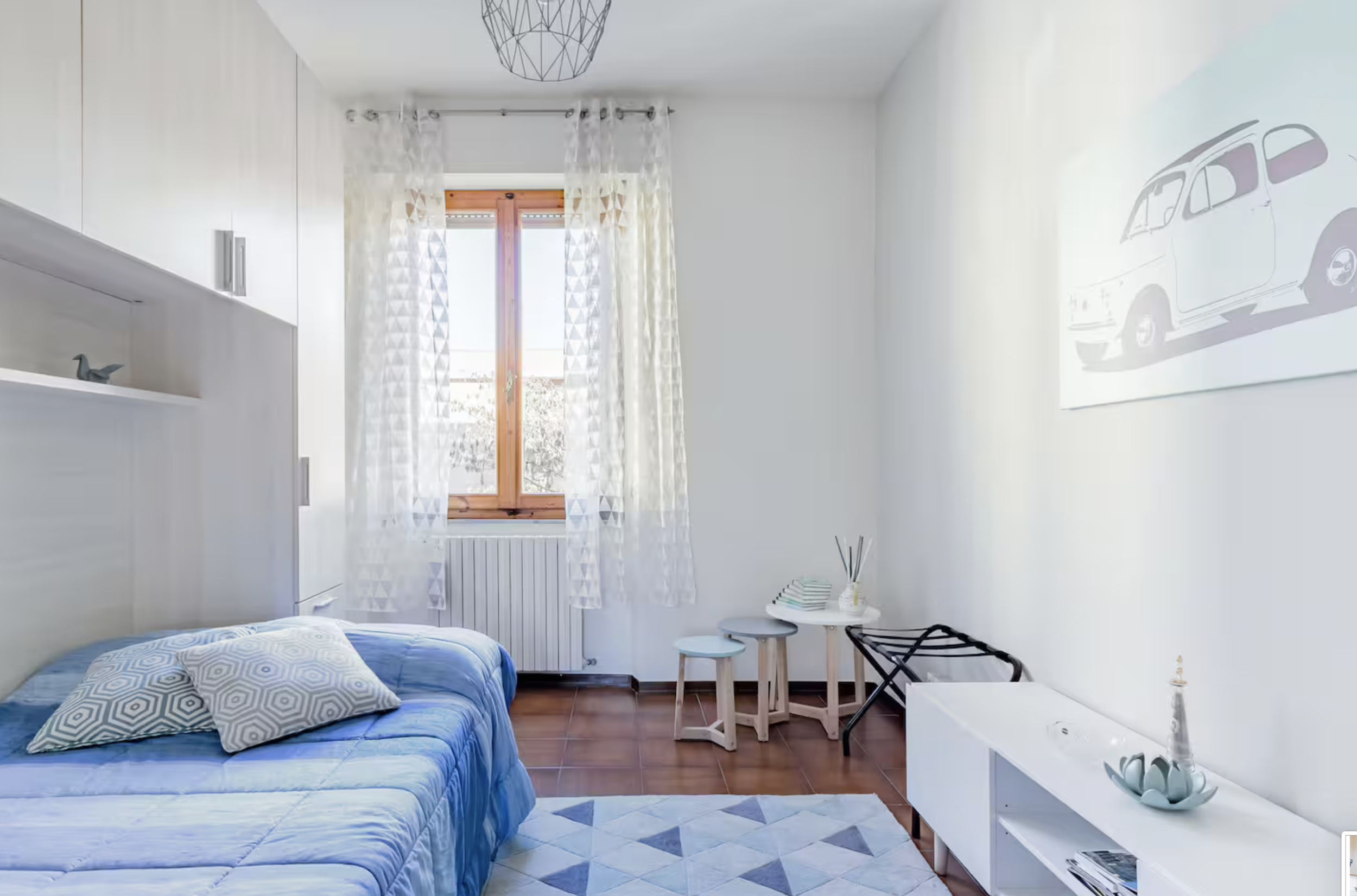 Bright second bedroom at Casa Luce Tuscany, a holiday apartment in Poggibonsi ideal for families and stays near Siena Eye Laser.