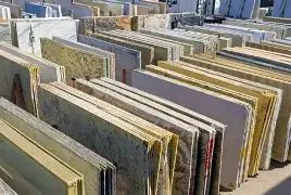 Rows of large stone or granite slabs standing upright outdoors.