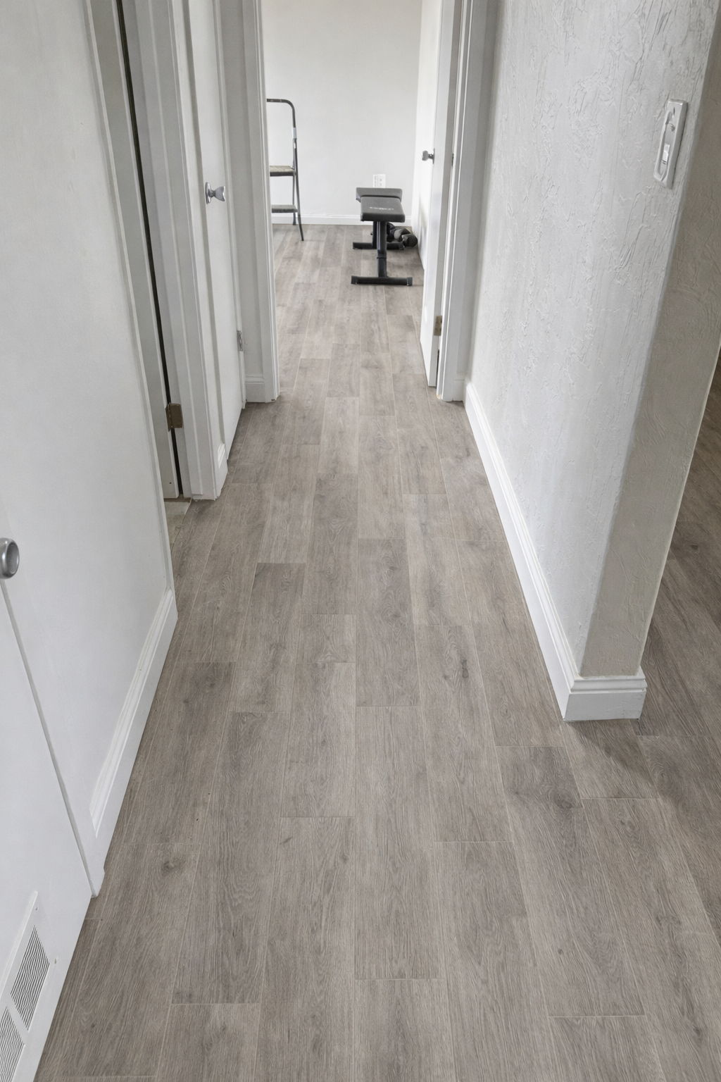 Finished hallway with matching wood-look flooring