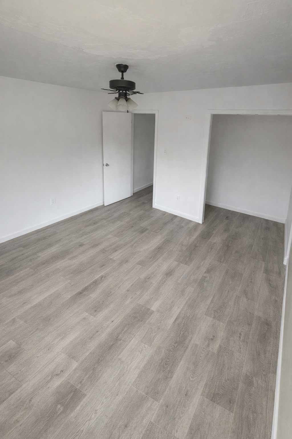 Finished bedroom with new wood-look flooring