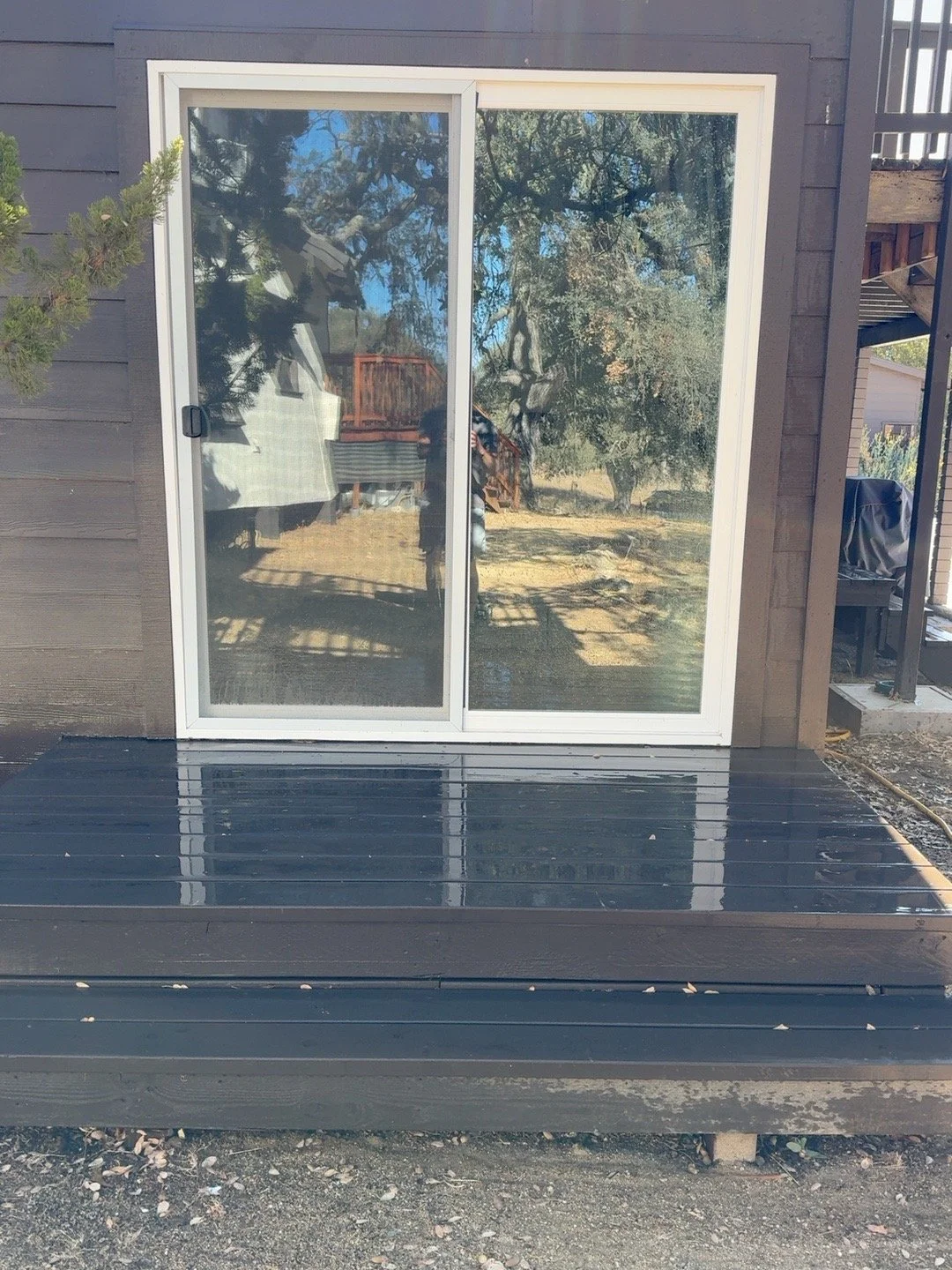 Finished sliding glass door and exterior deck conversion