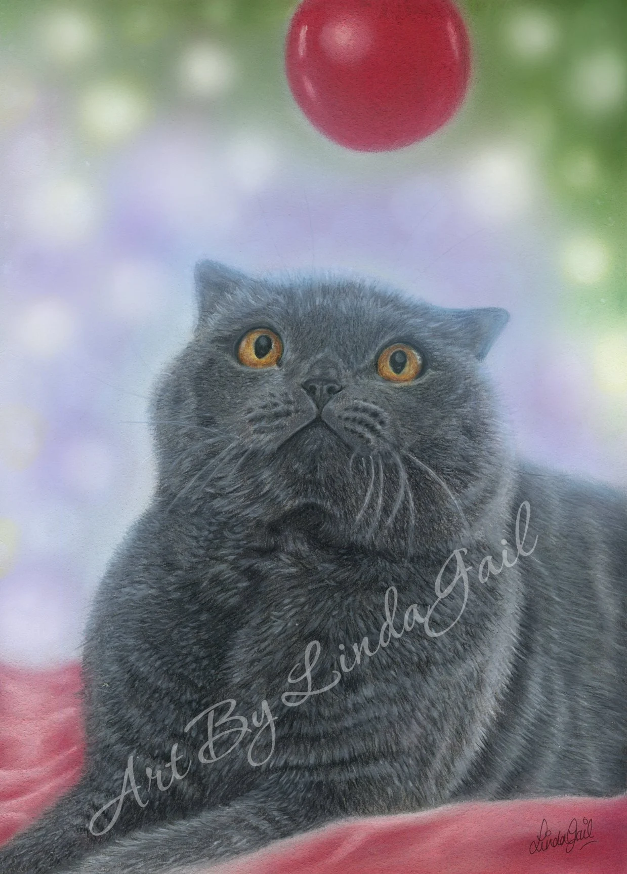 A coloured pencil drawing of a grey cat with orange eyes looking up at a red Christmas ornament hanging above it with blurred fairy lights in the background.  Christmas Cat artwork created by Linda-Gail