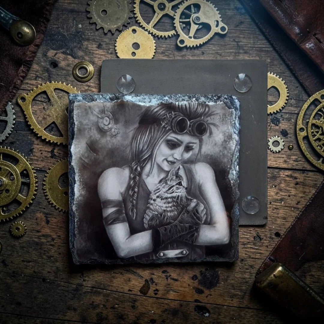 post apocalyptic steampunk cat lady artwork printed onto glossy slate coaster, flay lay on wooden table top with steampunk cogs scattered around
