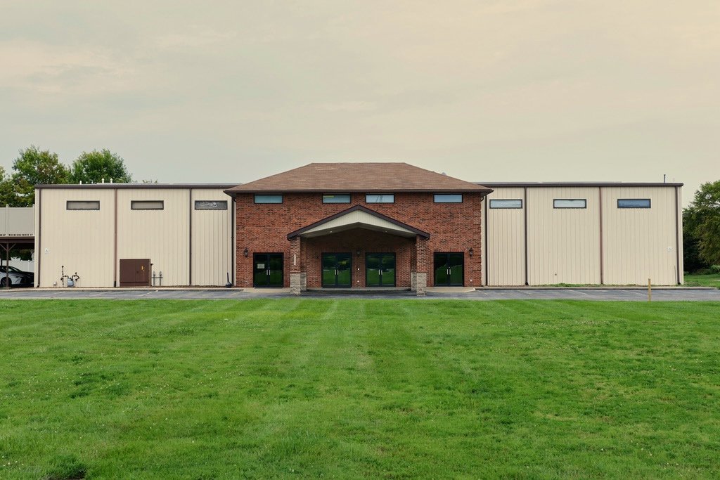 The front of Living Hope Church's new building at 4180 Smelting Works Road in Swansea, with its brick entrance and a wide green lawn.
