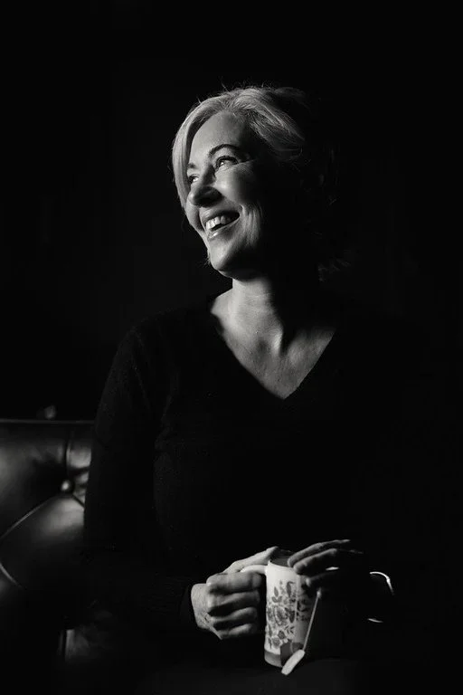 Vanessa Inn smiling while holding a mug